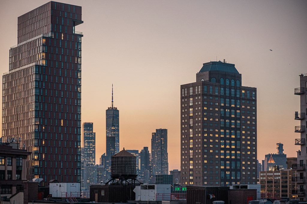 the skyline of the city at sunset